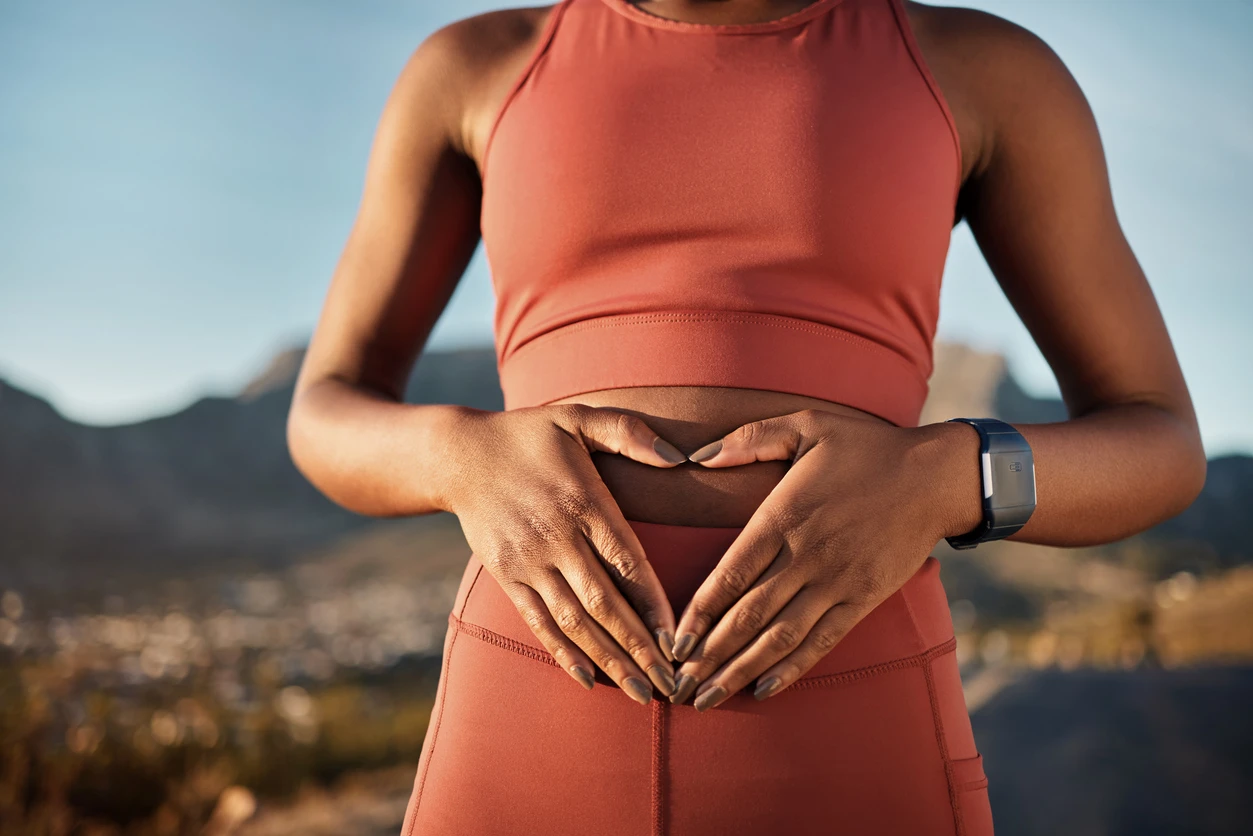 Woman, nature fitness or hands on stomach in diet wellness, body healthcare or abs muscle growth in workout training or sunrise exercise. Zoom, sports athlete or person, belly digestion or strong gut